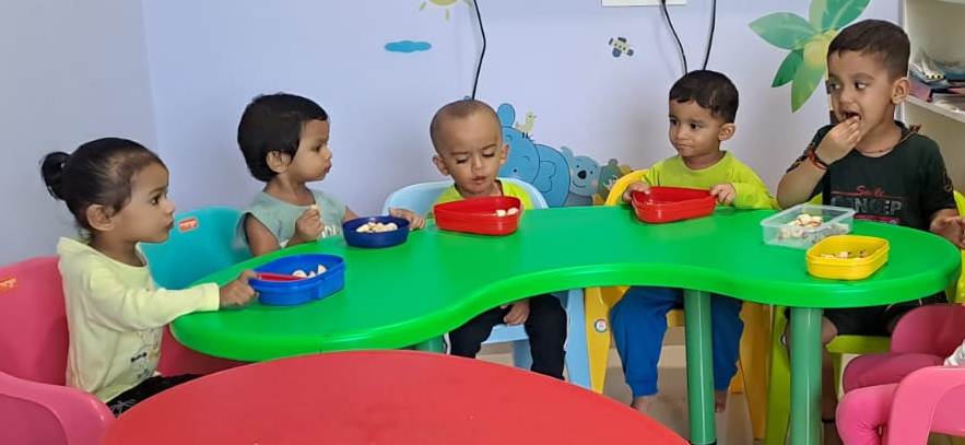 Happy senior kg students learning together
